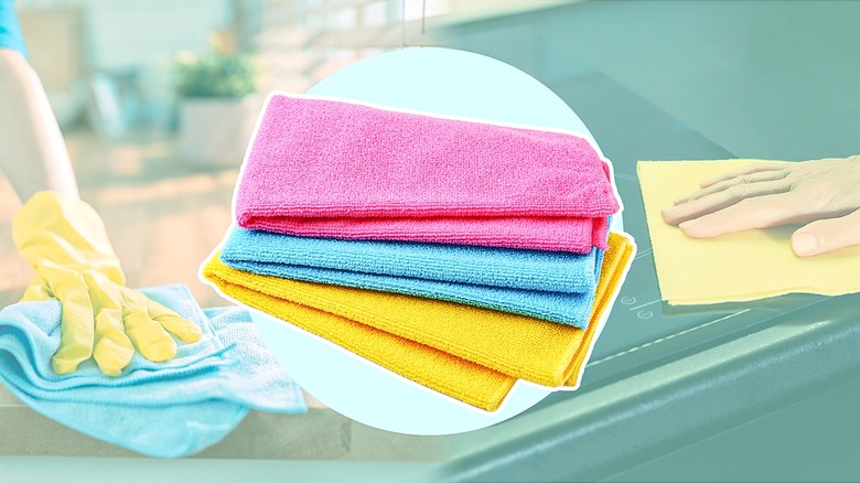 Two people cleaning their kitchens with a pile of colorful microfiber cloths in the center