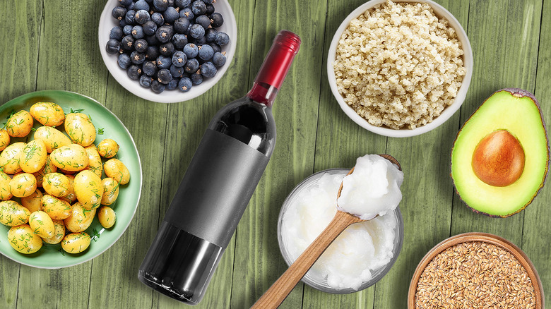 different types of superfoods on green background