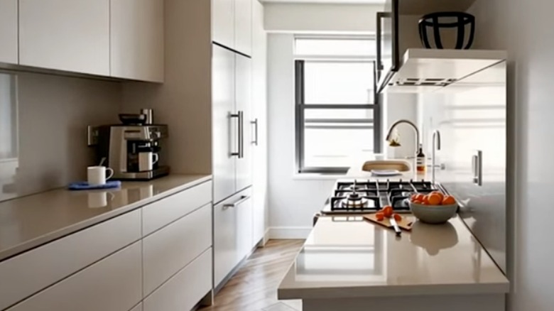 Small galley kitchen with a panelized refrigerator