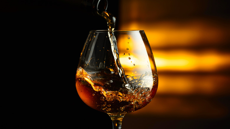 Cognac poured into snifter glass