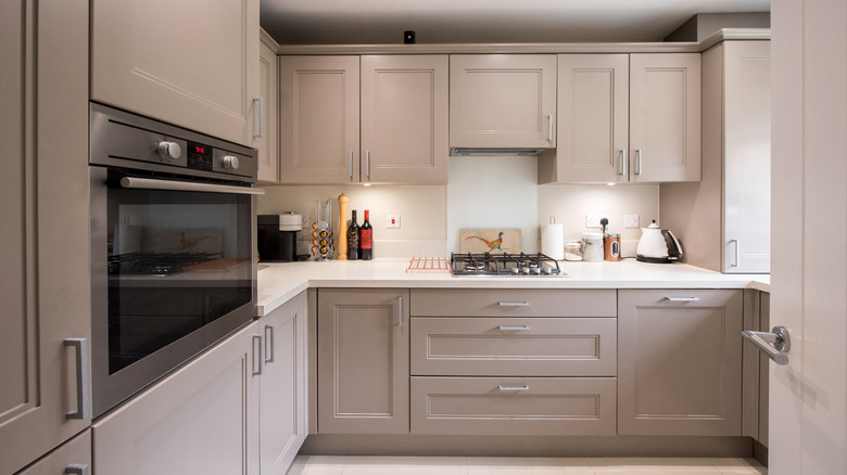 kitchen with gray upper and lower cabinets