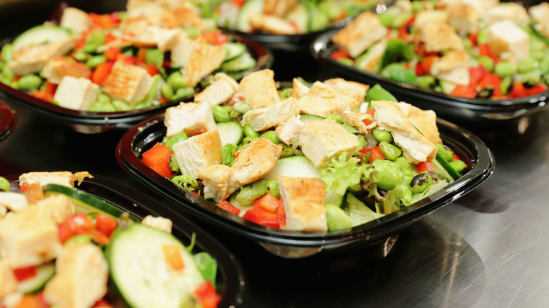 Wendy's to-go chicken salads in a row