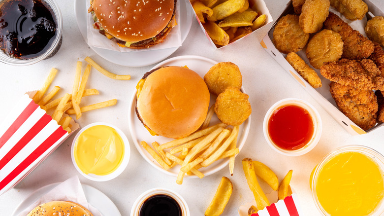 variety of fast food burgers, chicken, and fries
