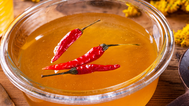 Chilies infused in a bowl of hot honey