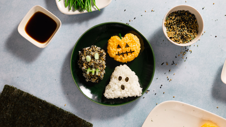 trio of halloween onigiri on plate